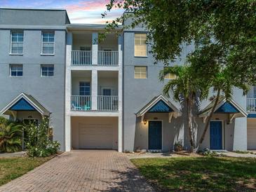 Charming townhome featuring a private garage and quaint balconies, perfect for enjoying Florida's sunshine at 4503 Legacy Park Dr, Tampa, FL 33611