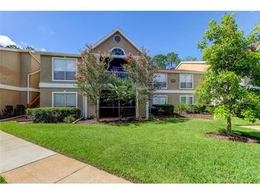 Charming two-story condo featuring a well-maintained lawn and delightful trees at 9481 Highland Oak Dr # 1308, Tampa, FL 33647