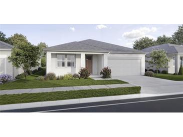 Charming single-story home with a well-maintained lawn, a driveway and an attached two car garage at 2791 Peake St, North Port, FL 34286