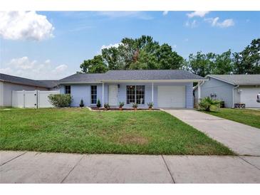 Charming single-story home with a well-manicured lawn and attached garage at 3733 Mendocino St, New Port Richey, FL 34655