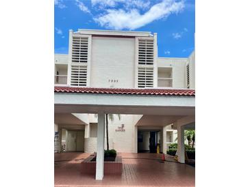 A well-maintained, multi-story building featuring architectural design and a welcoming covered entrance at 7893 Sailboat Key S Blvd # 304, South Pasadena, FL 33707