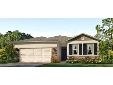 Charming single-Gathering home featuring stone accents, a two-car garage, and a well-manicured lawn at 8023 Sail Clover Ln, Zephyrhills, FL 33540