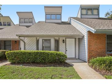 Charming townhome featuring unique architectural details and manicured landscaping at 5203 Oak Charter Ct # 5203, Temple Terrace, FL 33617