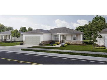 Charming one-story home with a gray roof, a two-car garage and a beautifully landscaped front yard at 5909 Bibb Ct, North Port, FL 34288