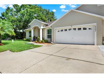 Charming single-Gathering home with a well-manicured lawn and an attached two-car garage at 10597 Alvarado Ct, Seminole, FL 33772