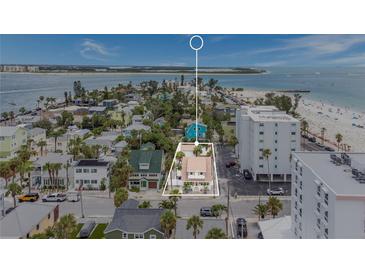 Beautiful aerial view of coastal property with sandy beaches and ocean views in a lovely neighborhood at 108 5Th Ave, St Pete Beach, FL 33706