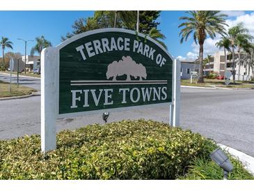 Terrace Park of Five Towns community sign with lush landscaping and palm trees on a sunny day at 8198 Terrace Garden Dr # 511, St Petersburg, FL 33709