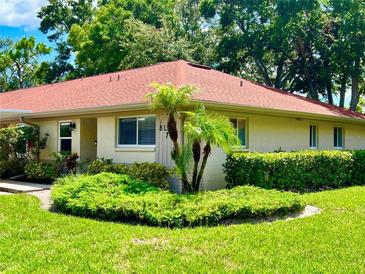 Inviting single-story home with mature landscaping and a red roof for a charming curb appeal at 2460 Northside Dr # 708, Clearwater, FL 33761