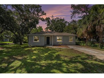 Charming single-story home featuring a well-manicured lawn and mature trees, offering great curb appeal at 3205 68Th N Ave, St Petersburg, FL 33702