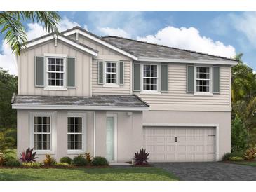 Charming two-story home featuring a two-car garage, green shutters, and well-maintained landscaping at 17927 Cropside Trl, Lakewood Ranch, FL 34211