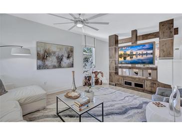 Bright living room features modern decor, stylish furniture, and a custom entertainment center at 1119 Highland S St, St Petersburg, FL 33701