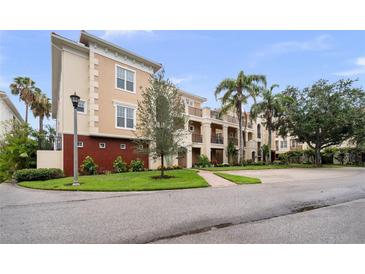 Inviting exterior of the home features lush landscaping, manicured lawns, and a well-maintained facade at 6 Academy S Way # 221, St Petersburg, FL 33711