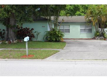Charming single story home with mature trees and a well maintained lawn in a quiet neighborhood at 2058 Dodge St, Clearwater, FL 33760