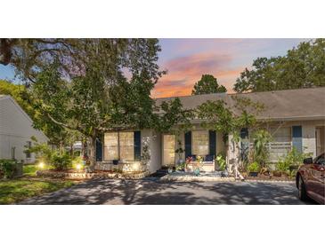 Charming home exterior featuring lush landscaping and inviting curb appeal at 1136 Thayer St, Safety Harbor, FL 34695