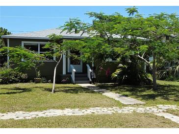 Charming home with lush landscaping and stone walkway, perfect for curb appeal at 4350 2Nd S Ave, St Petersburg, FL 33711