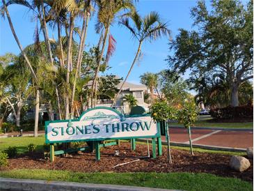Inviting condominium complex sign surrounded by lush landscaping, offering a glimpse of the charming community at 6932 Stones Throw N Cir # 7101, St Petersburg, FL 33710
