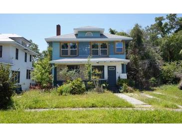 Inviting two-story home boasts classic architecture and a spacious front yard at 2355 Trelain S Dr, St Petersburg, FL 33712