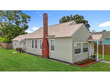 Charming single-Gathering home featuring neat landscaping and a classic brick chimney at 3327 25Th N St, St Petersburg, FL 33713