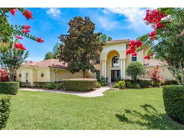 Inviting home showcasing a well-manicured lawn and lush landscaping at 3042 Wentworth Way, Tarpon Springs, FL 34688