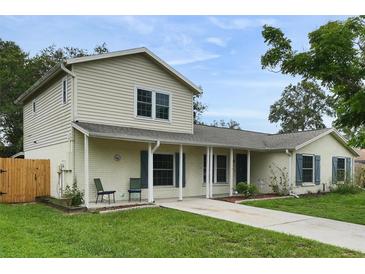 Charming two-story home boasts a well-maintained lawn, inviting entryway, and appealing architectural details at 1305 Willow Valley Dr, Brandon, FL 33510