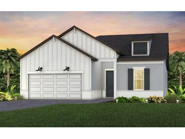 Charming single-Gathering home showcasing a modern farmhouse design with a two-car garage at 13660 Canyon Ridge Rd, Spring Hill, FL 34610