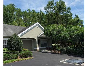 Charming home featuring an attached garage and well-maintained landscaping at 3493 Kings Rd # 106, Palm Harbor, FL 34685