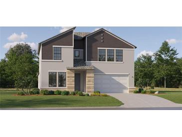 Two-story home featuring a two-car garage, neutral stucco, dark brown accents, and a covered front entryway at 9360 Gladsome Dr, Land O Lakes, FL 34637