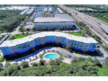 Scenic aerial view of a condo with a pool, close to the marina and highway at 3315 58Th S Ave # 115, St Petersburg, FL 33712