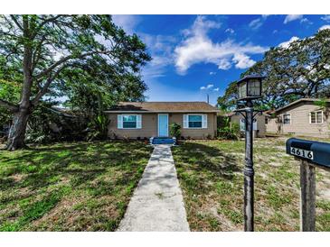 Charming single-story home with well-maintained lawn and inviting walkway leading to the front door at 4616 5Th N Ave, St Petersburg, FL 33713
