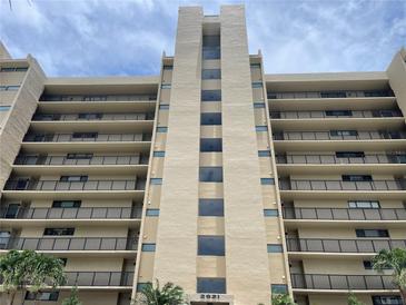 Stunning exterior view of the condo building with multiple stories and beautiful balcony views at 2621 Cove Cay Dr # 206, Clearwater, FL 33760