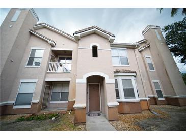 Charming condo with stucco exterior, balcony and tiled roof, offering a desirable curb appeal at 10409 Villa View Cir # 10409, Tampa, FL 33647