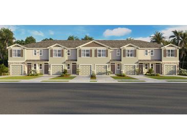 New townhome exteriors showcase neutral color schemes and coordinated window shutters at 2472 Riversong Lodge Ln, Wesley Chapel, FL 33543