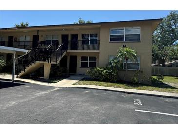 Exterior view of two-story building with parking at 2501 Harn Blvd # H20, Clearwater, FL 33764
