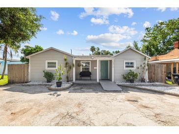 Charming single-story home with a quaint front porch and well-manicured landscaping at 5315 40Th N St, St Petersburg, FL 33714