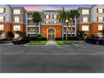 Exterior view of a modern condo building with well-maintained landscaping and a private parking area at 7903 Seminole Blvd # 2203, Seminole, FL 33772