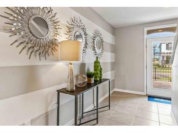 Inviting entryway featuring modern decor and neutral tones at 2621 Birney Run, Zephyrhills, FL 33541