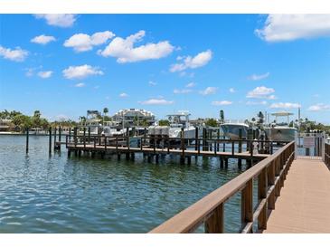 This waterfront property features a private boat dock with multiple boat slips for easy water access at 3805 Gulf Blvd # 401, St Pete Beach, FL 33706