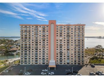 A high-rise condo building with many balconies overlooking beautiful blue skies and calm water at 4900 Brittany S Dr # 1011, St Petersburg, FL 33715