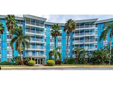 Blue building exterior, palm trees, and parking lot at 3315 58Th S Ave # 218, St Petersburg, FL 33712