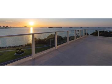 Balcony with sunset views over the water at 1020 Sunset Point Rd # 603, Clearwater, FL 33755