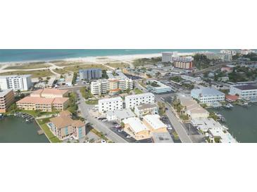 Aerial view of beachside community, showcasing multiple buildings at 11605 1St E St # 6, Treasure Island, FL 33706