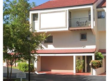 Two-story condo building with attached garage at 240 Windward Psge # 504, Clearwater, FL 33767