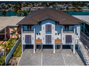 Three-story building with waterfront views and private parking at 12305 3Rd E St # 1, Treasure Island, FL 33706