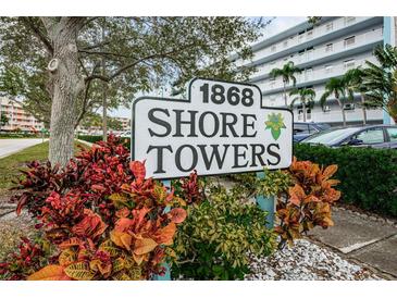 Shore Towers building sign with landscaping at 1868 Shore S Dr # 410, South Pasadena, FL 33707