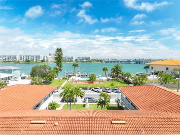 Aerial view of waterfront community and pool at 7740 Boca Ciega Dr # 209, St Pete Beach, FL 33706