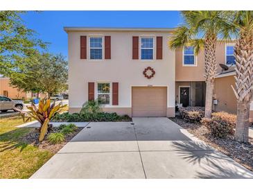 Two story townhome with garage and landscaping at 12904 Shady Fern Ln, Gibsonton, FL 33534