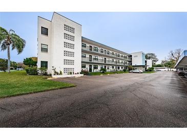Condo building with parking area at 5969 Terrace Park N Dr # 304, St Petersburg, FL 33709