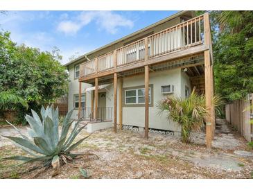 Two-story home with elevated deck and tropical landscaping at 145 17Th Se Ave, St Petersburg, FL 33701