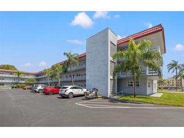 Exterior view of a two-story building with parking at 5660 80Th N St # A208, St Petersburg, FL 33709