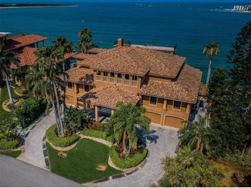 Luxury waterfront home with expansive driveway and ocean views at 806 Columbus Dr, Tierra Verde, FL 33715